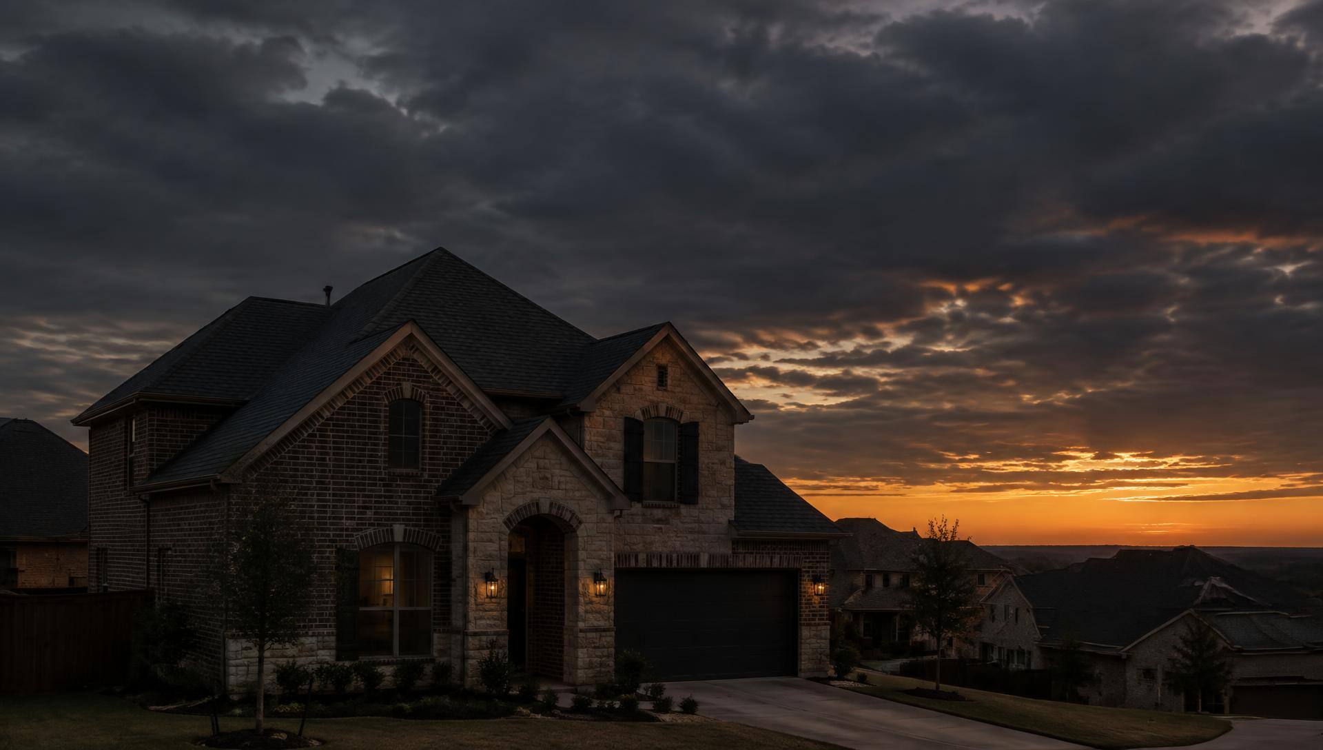 North Texas home at dusk with a completed shingle roof