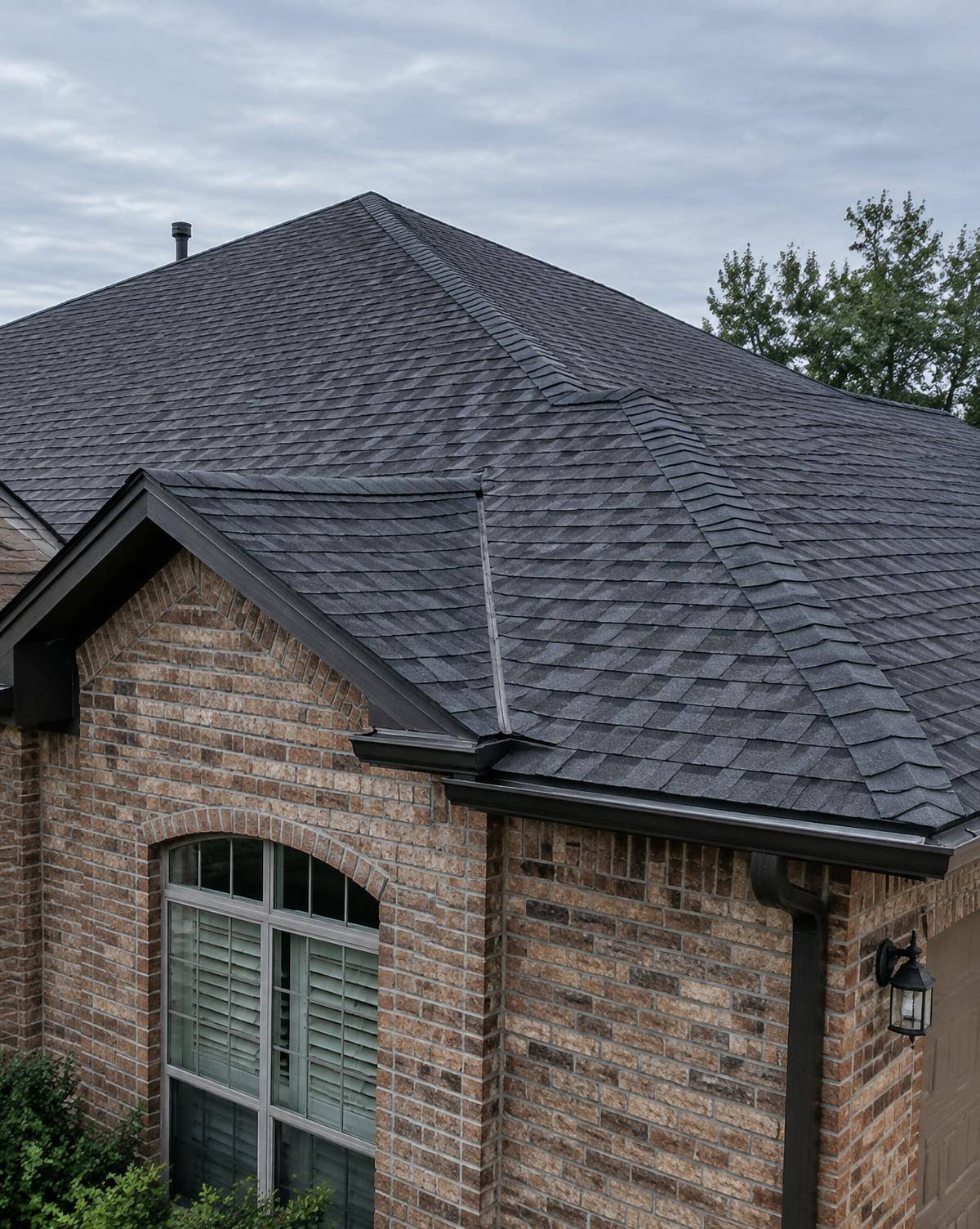 Completed architectural shingle roof on a North Texas brick home